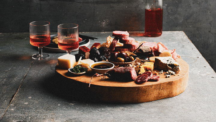Wooden platter with cured meats, cheese, and olives at the Sydney Royal Fine Food Show Smallgoods & Charcuterie Competition.